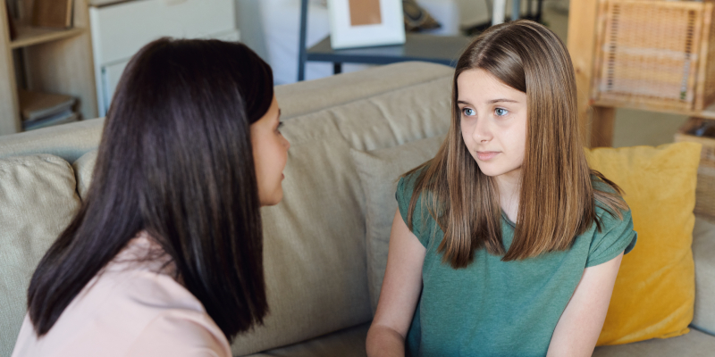 mom has discussion with daughter