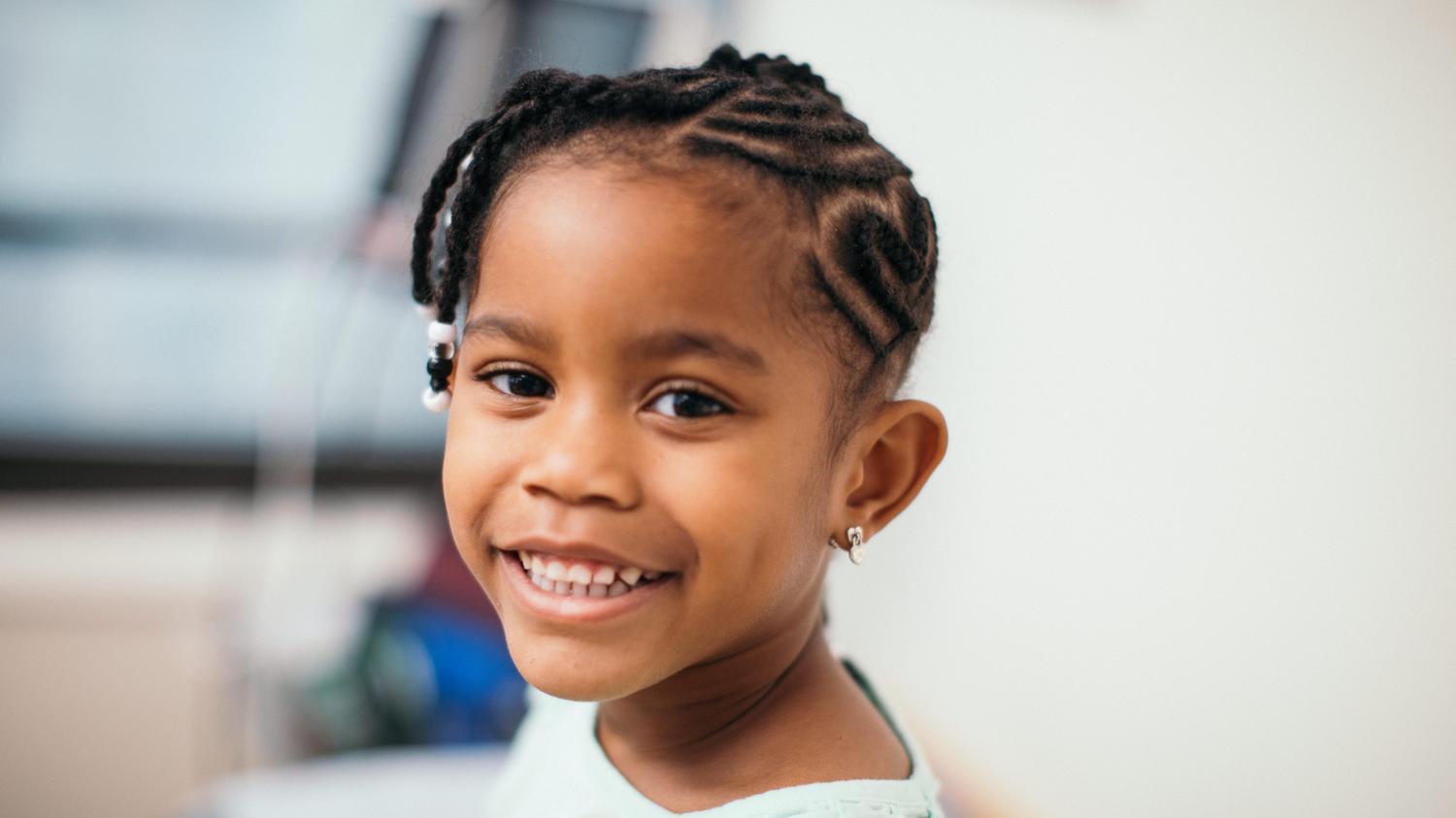 girl smiling in exam room