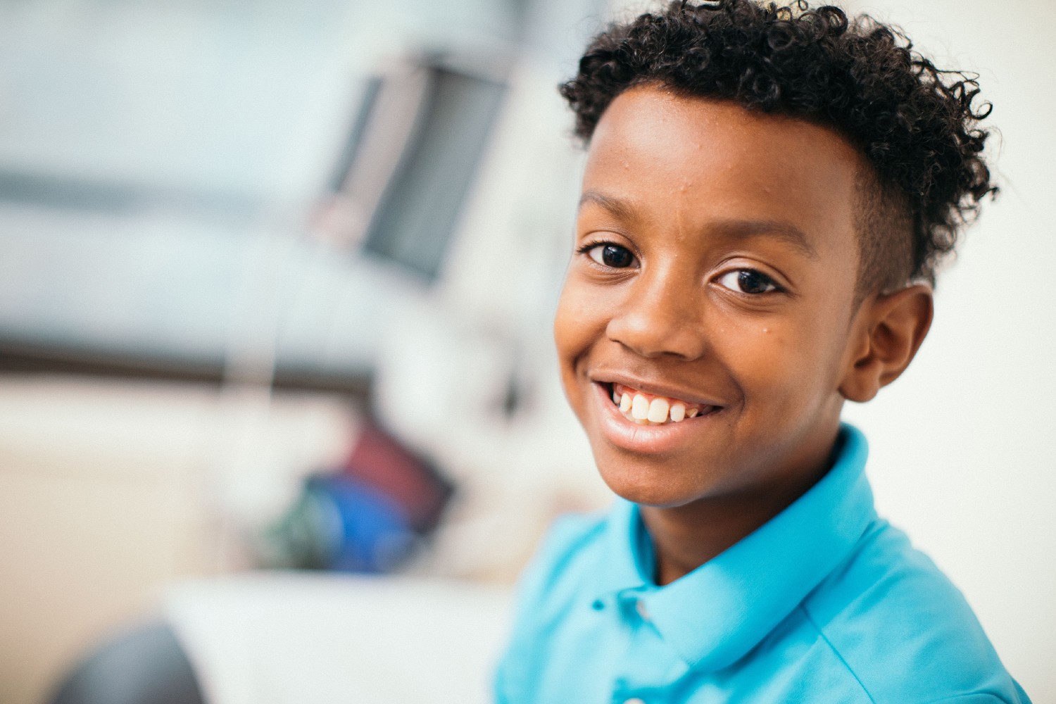 Young boy smiling in exam room