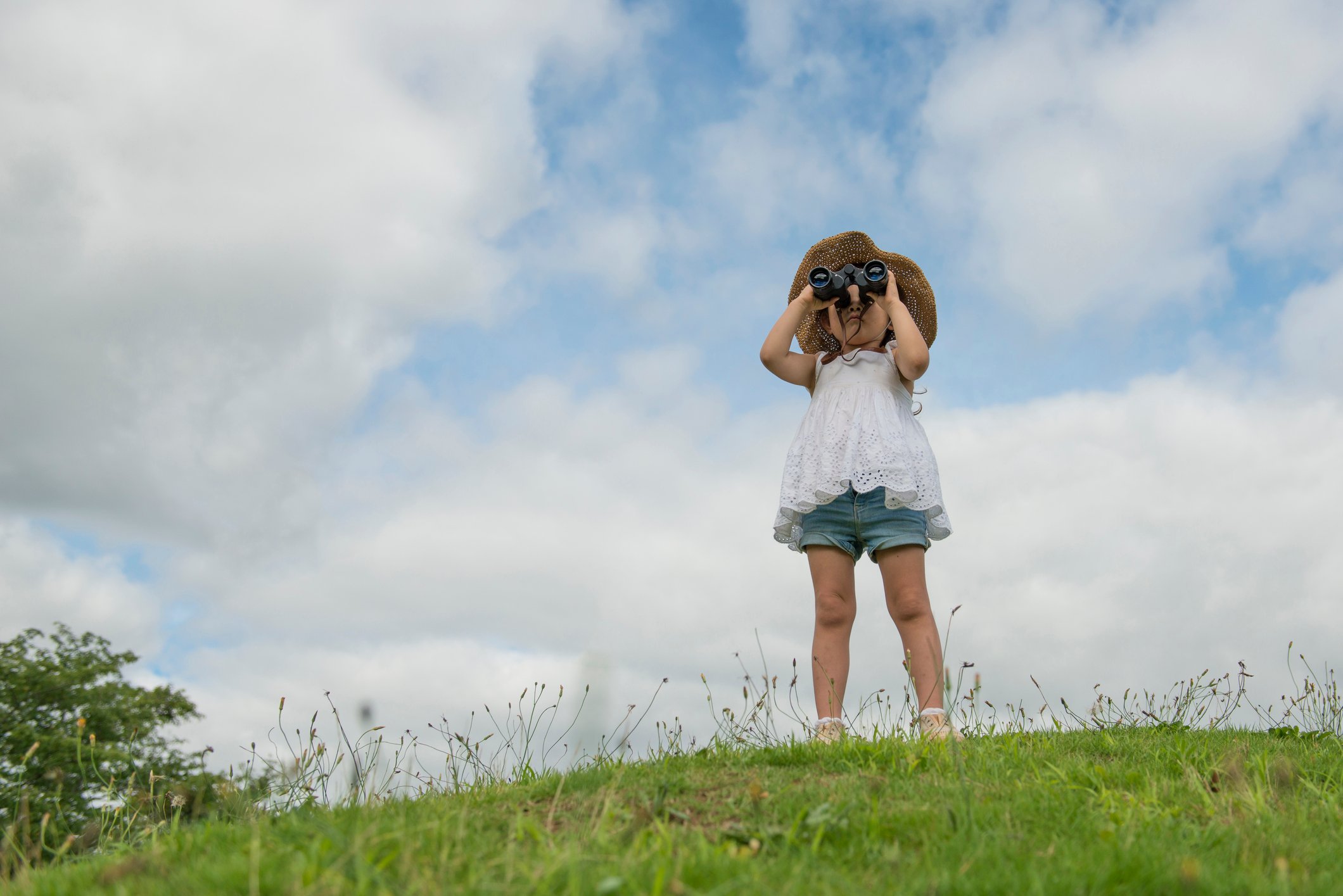 Girl looking through binoculars