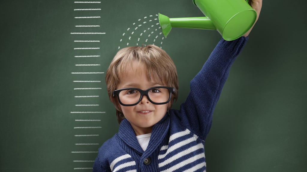 child with watering can