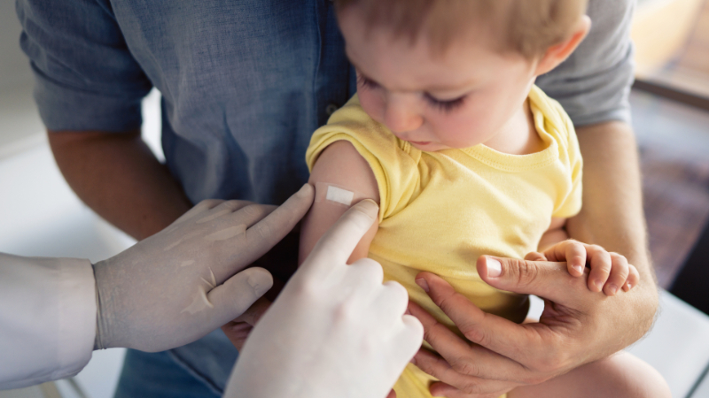 baby gets bandaid after vaccine