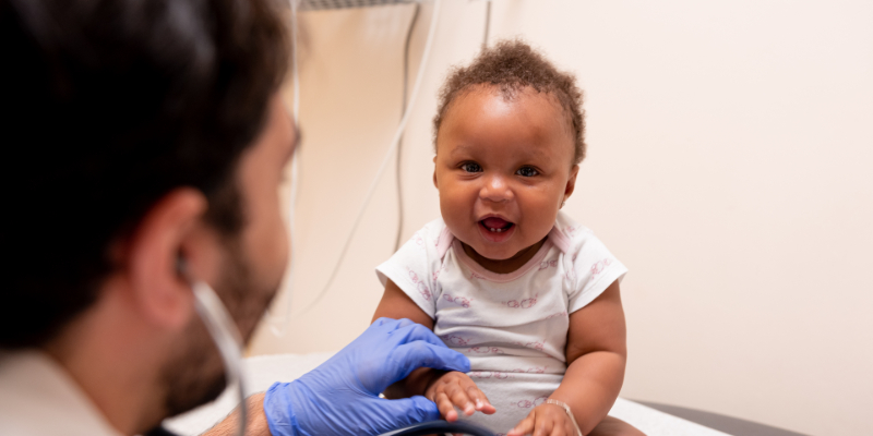 smiling baby at doctor's appointment