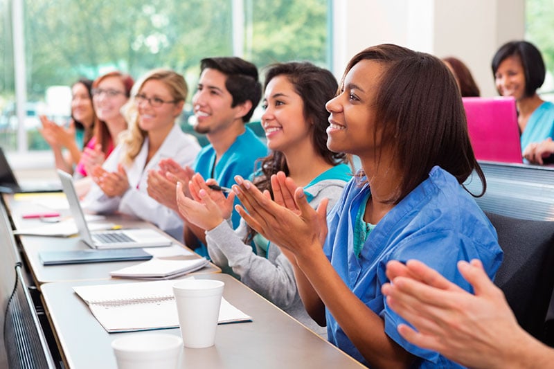 doctors and nurses clapping