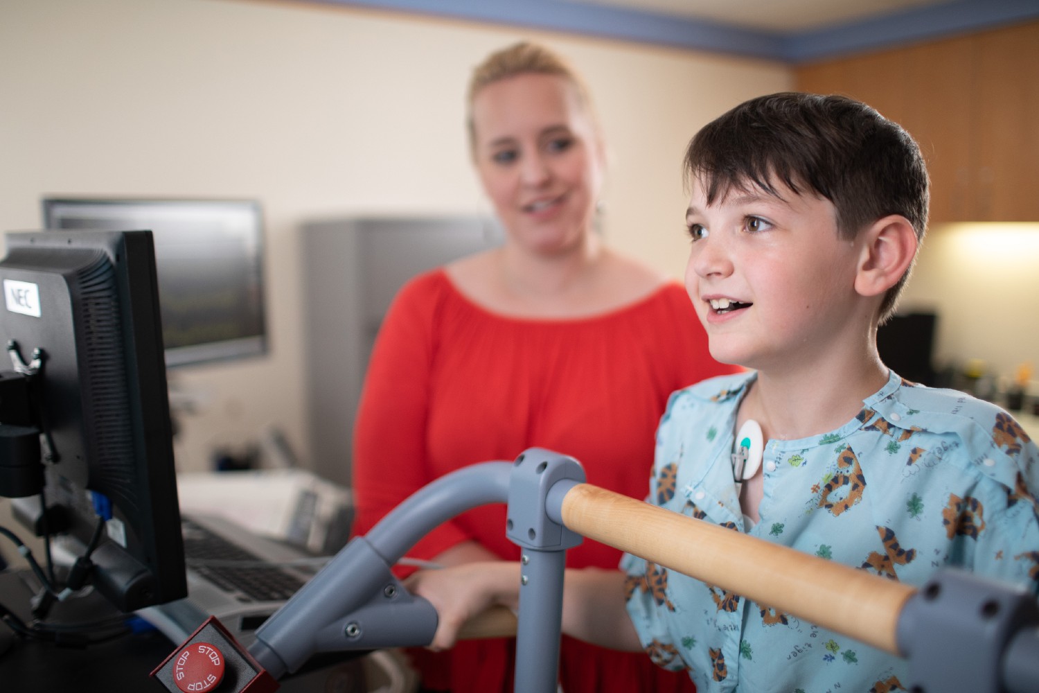 Boy in Stress Lab with a Provider in Red.