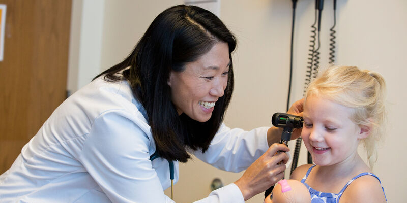 Dr. Fu examines patient