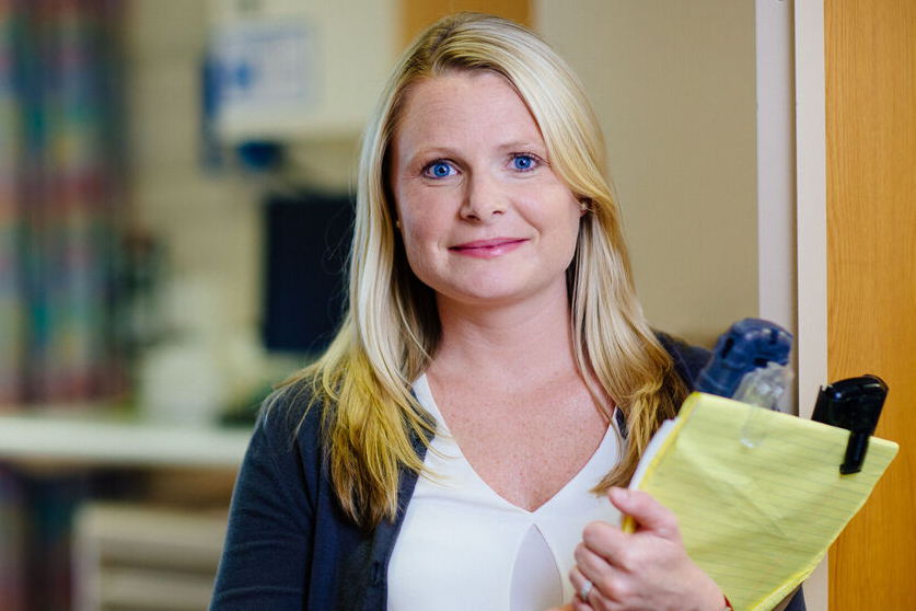 woman holding clipboard