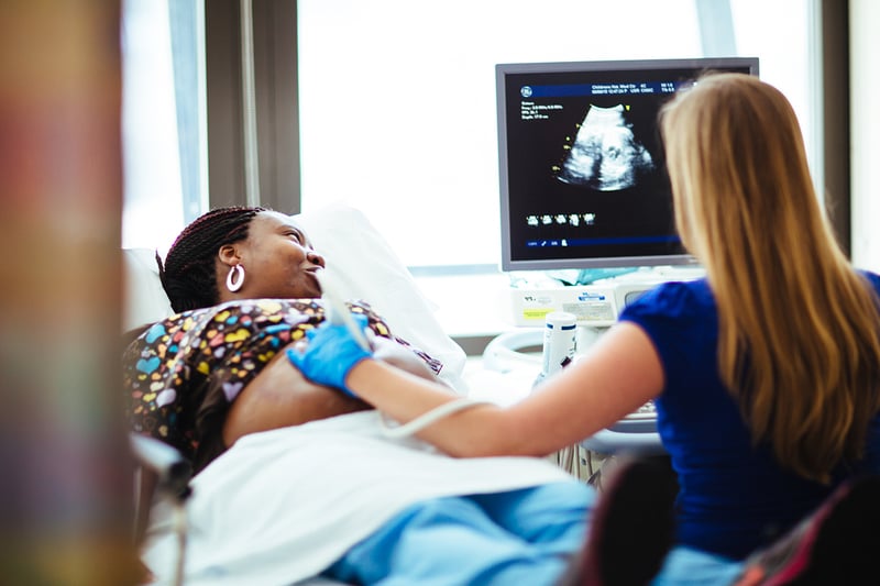 A Children's Heart Institute Fetal Heart Program Fetal Cardiac Imaging Program nurse performs a fetal echocardiography.