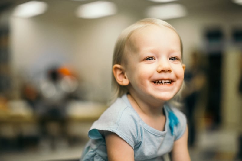 Happy smiling girl in exam room.