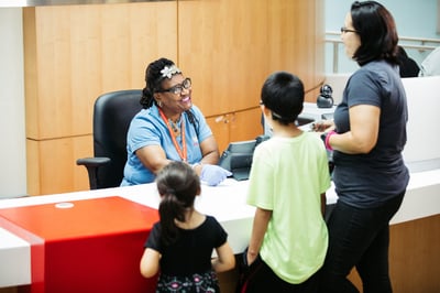 Patients and Mother at Welcome Desk