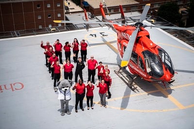 Children's National Sky Bear Transport Team on the hospital rooftop helipad next to helicopter