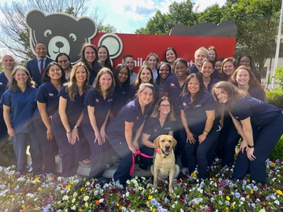 The members of the Colorectal & Pelvic Reconstruction team outside of the main entrance to Children's National Hospital.