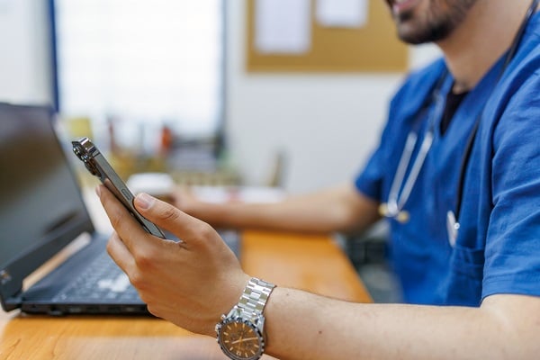 Male nurse on phone