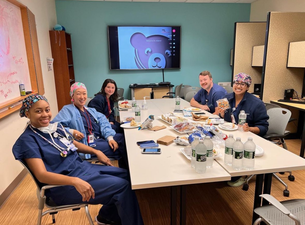 Anesthesiology fellows sit in a classroom.