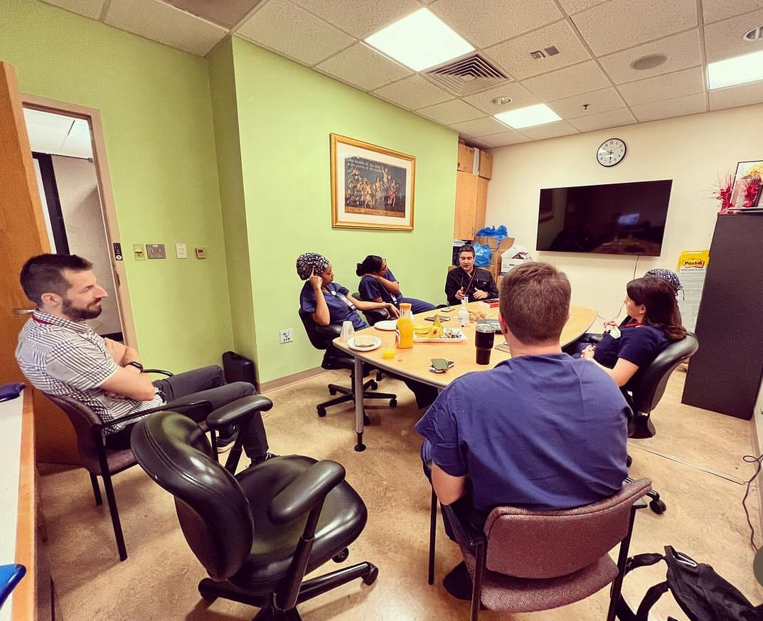 Class of fellows sitting together.