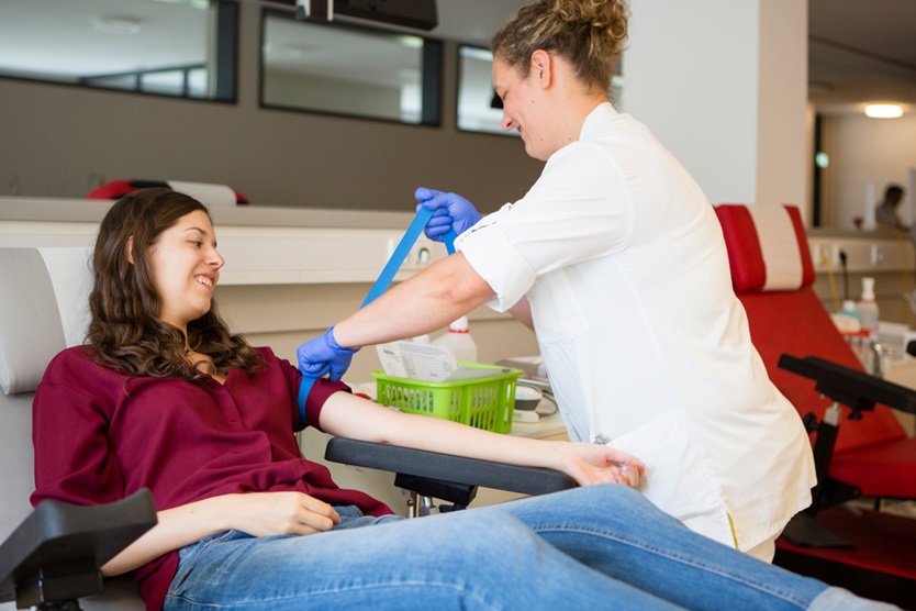 woman donates blood