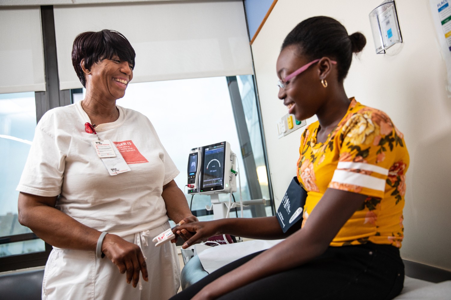 Cardiology nurse with patient