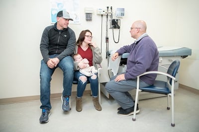 Dr. Marc Levitt chats with a family.