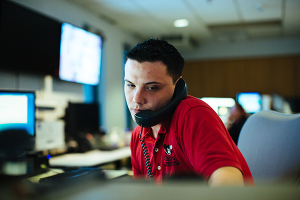 Man on phone in emergency call center