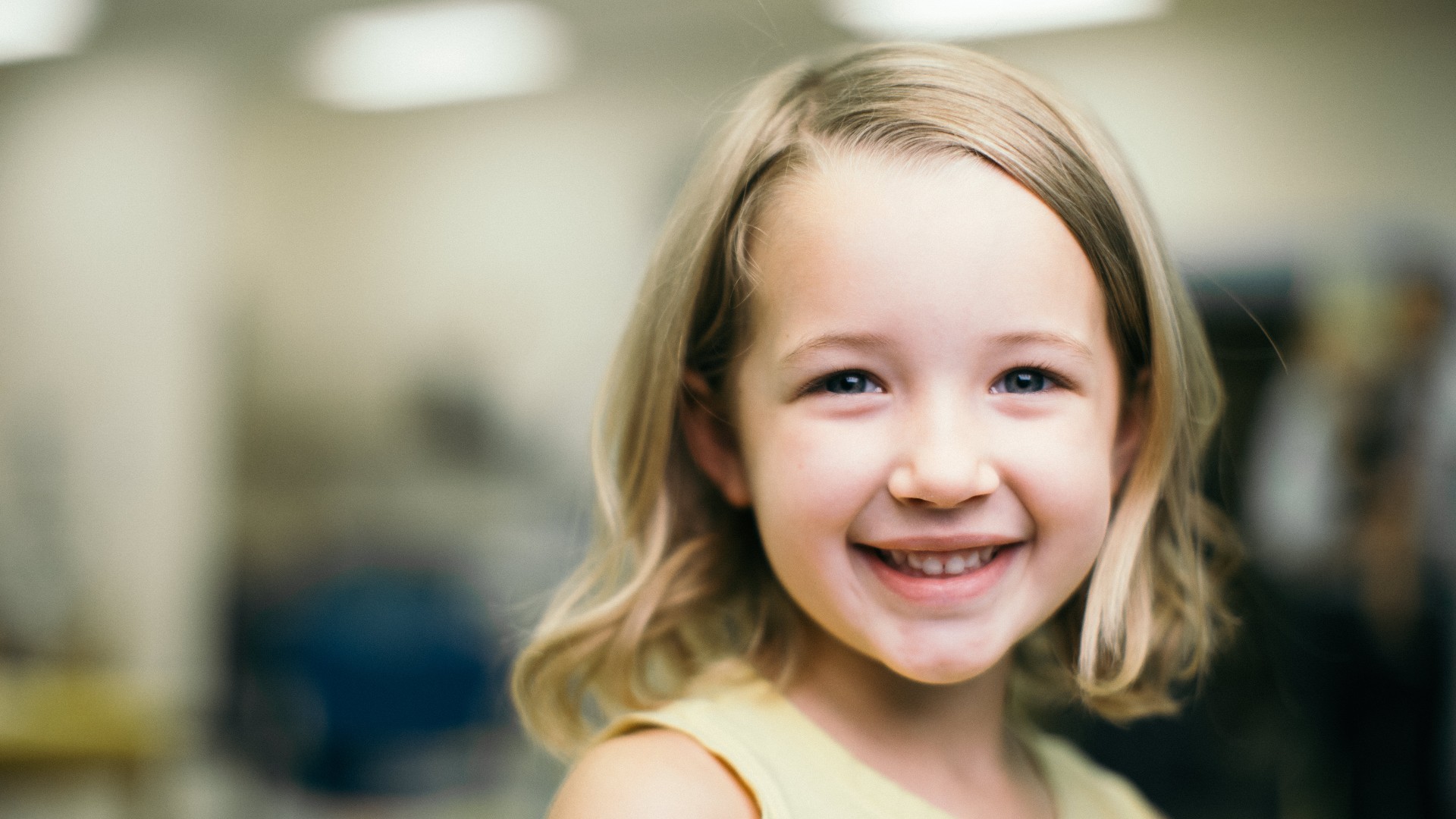 Young girl smiling in hallway