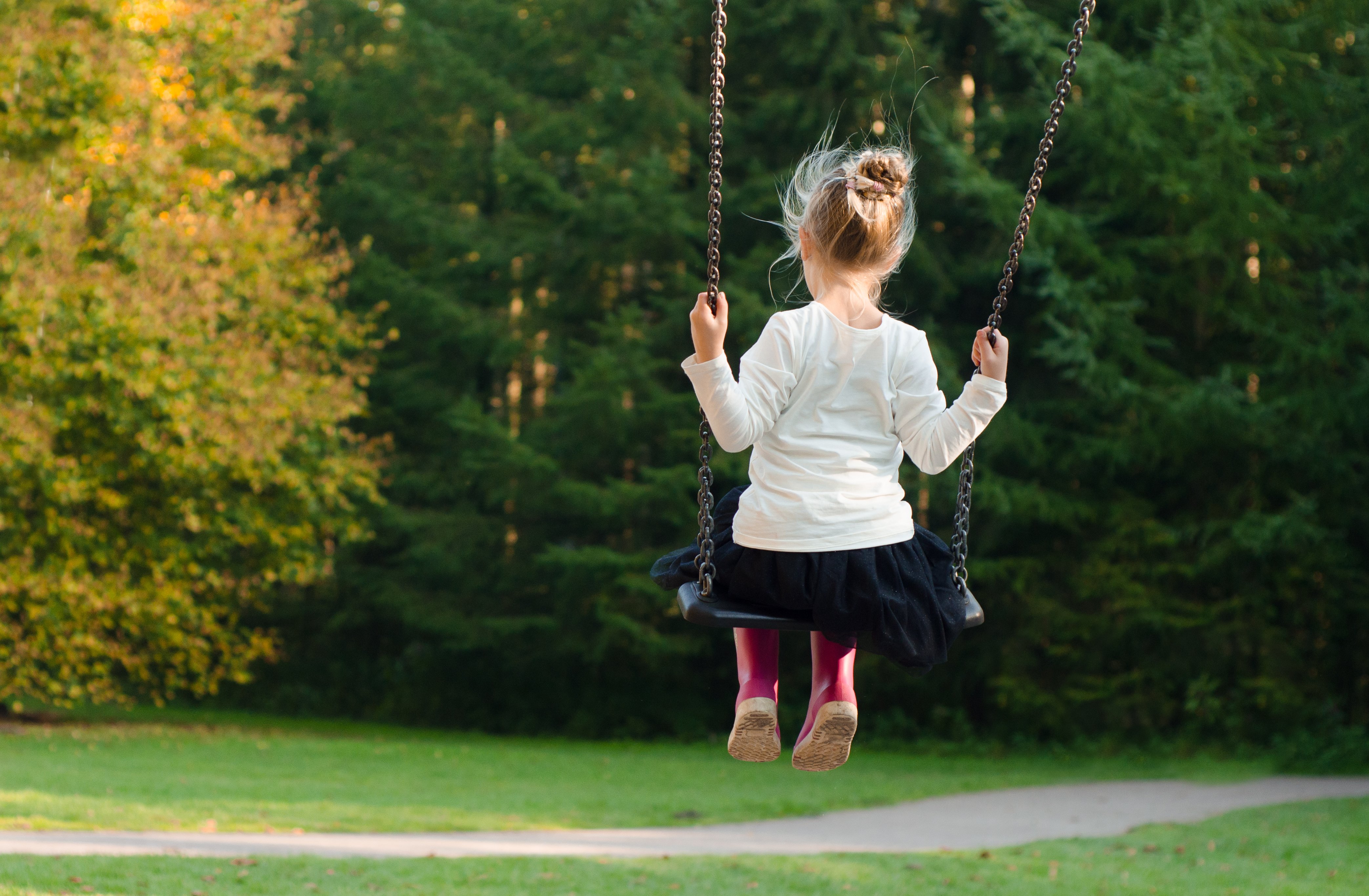 Child on a swing outdoors