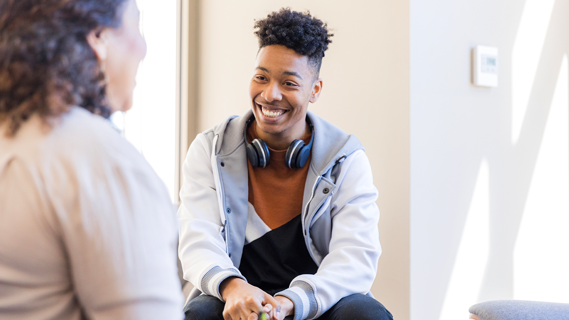 teen boy smiling during therapy session