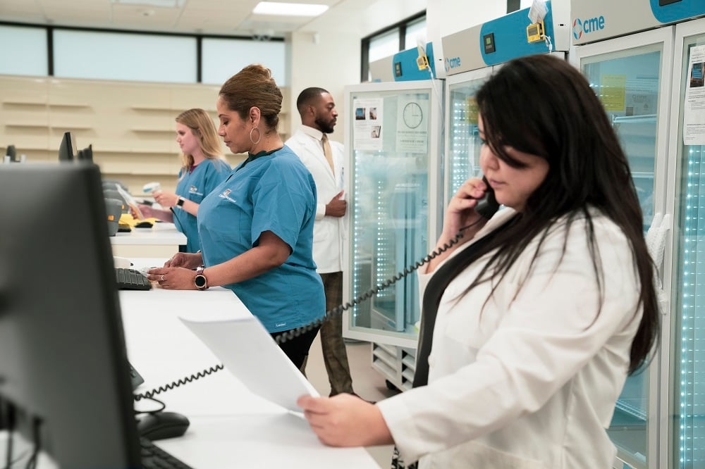 Staff at the Children's National Specialty Pharmacy work on filling orders