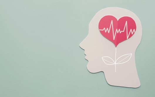 Illustration of a heartbeat inside a heart inside a person's head