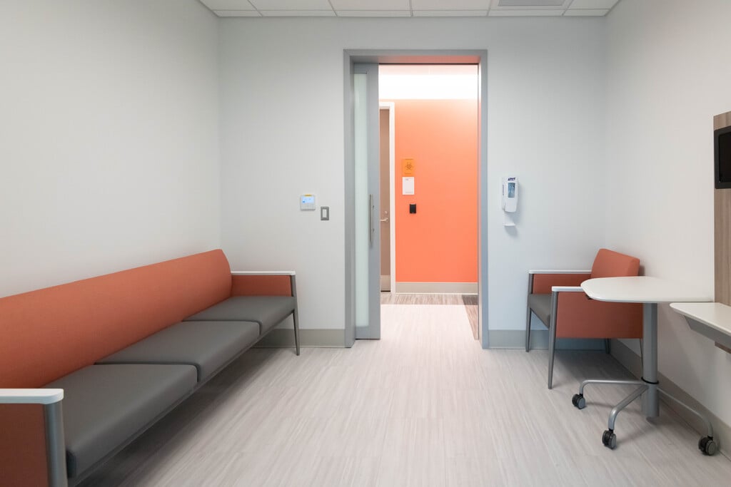 A consultation area with a couch and chair at the Rare Disease Institute.