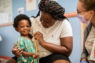 Mother and child in oncology (cancer) unit 