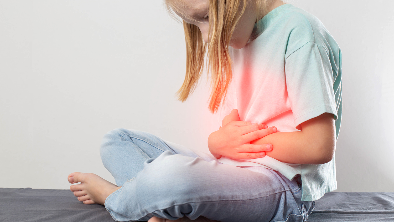 Girl holding her stomach