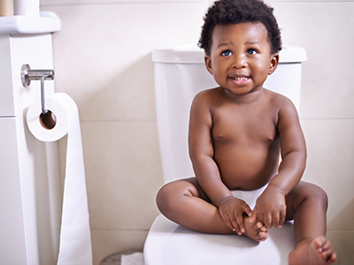 little boy sitting on the toilet