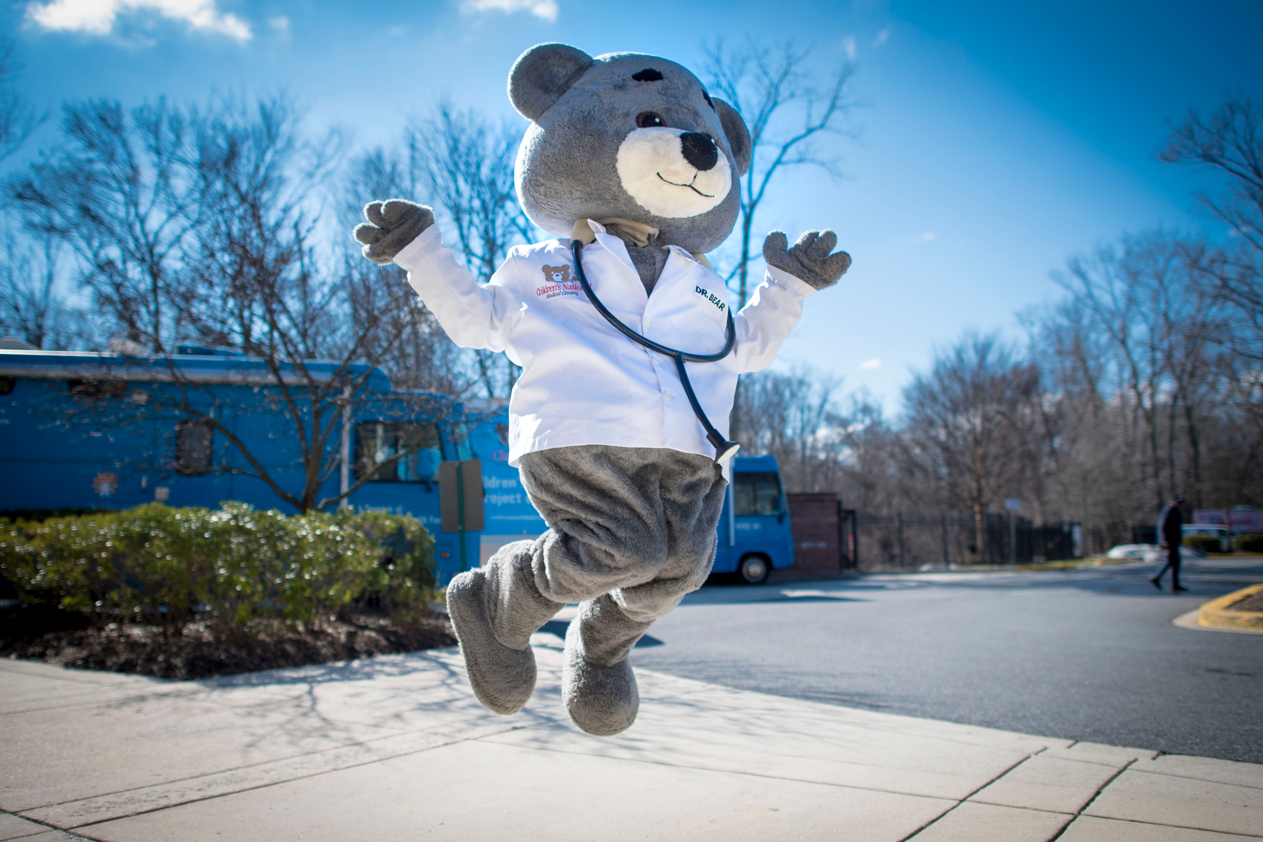 Dr. Bear in a jumping pose