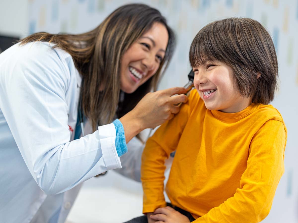 provider looking at child's ear