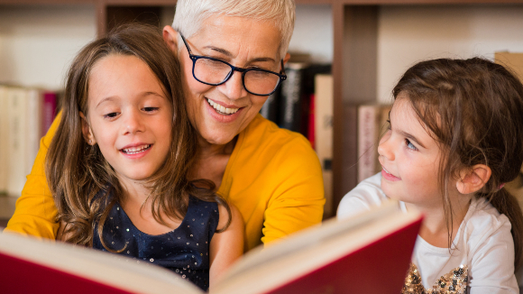 Woman reading to children