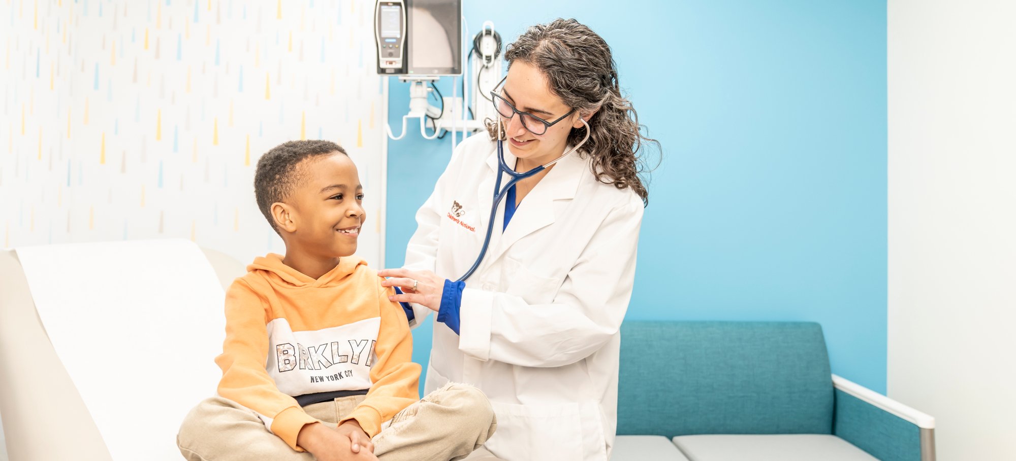 doctor examines young boy