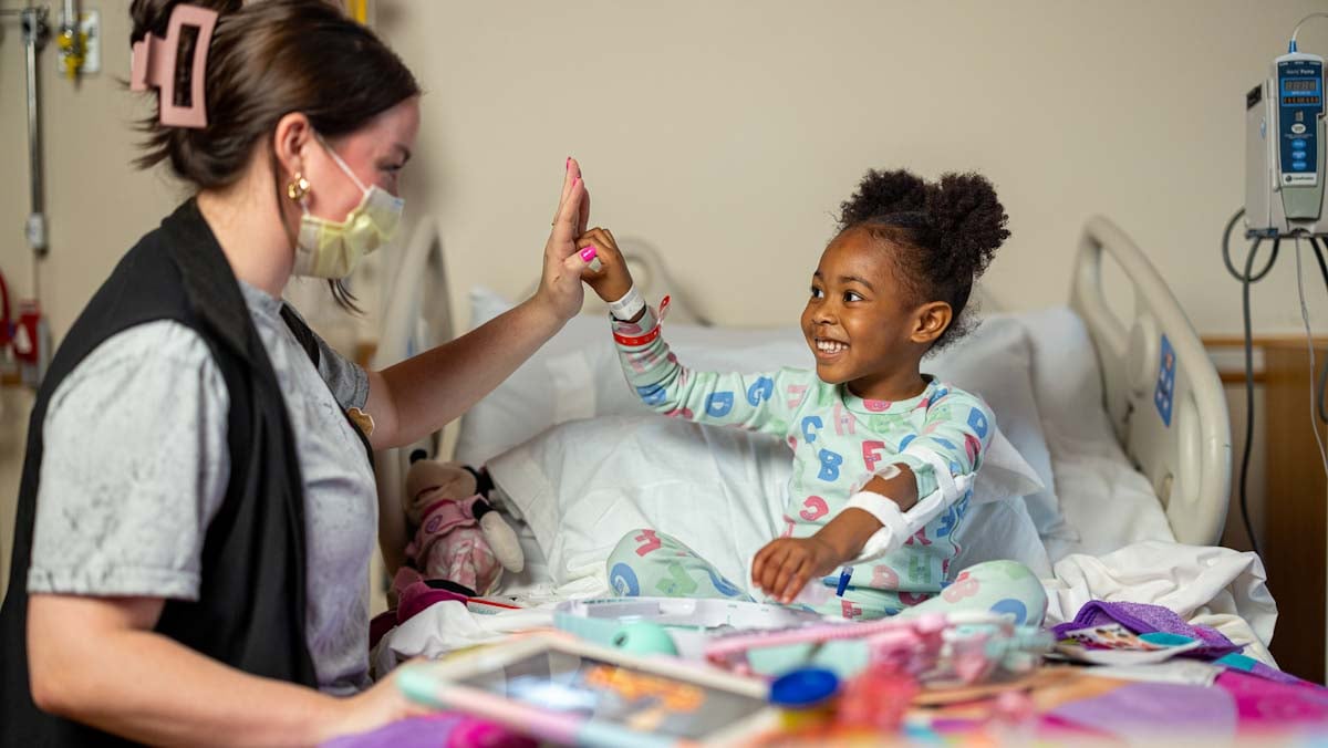 young girl giving provider a high five