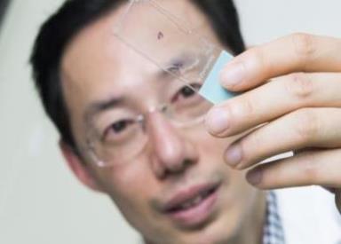 Children's National researcher examining object