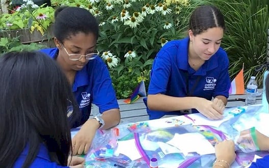 Summer volunteers work on a group activity at Children's National Hospital.