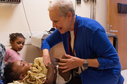 Pediatrician with toddler in exam room