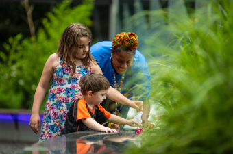 Children with provider in garden