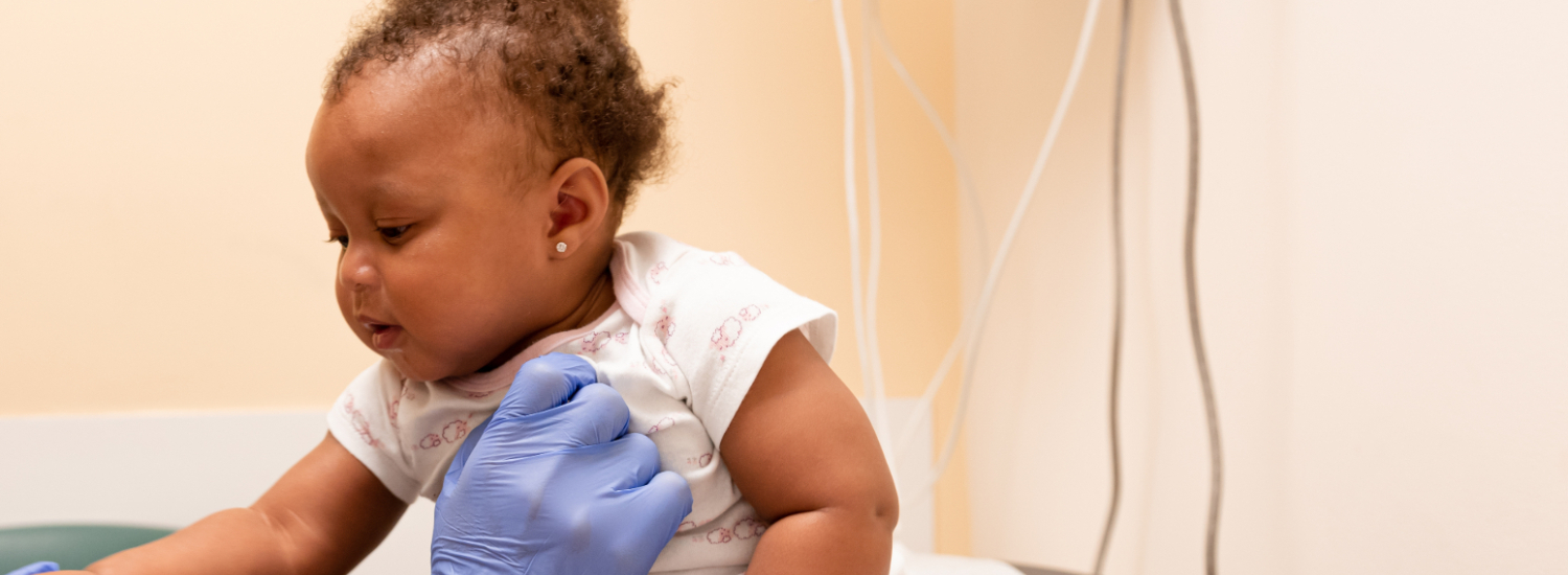 baby on exam table