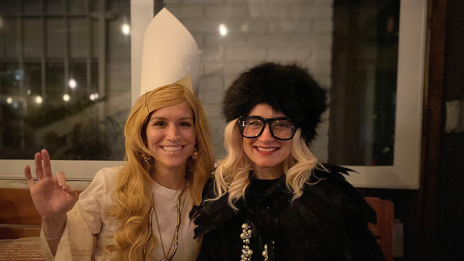 Two women smiling in costumes