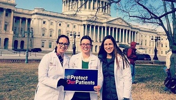 residents in front of the Capitol