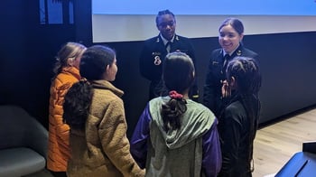 Jasmine Forbes and Cecelia Rech speak with girls during the event.