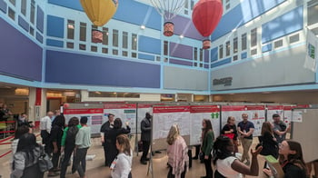 Poster session at the Costco Wholesale Atrium.