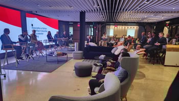 Audience listening to the panel discussion at the Association of British HealthTech Industries meeting.