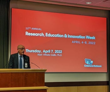 Dr. Vittorio Gallo presenting during REI Week 2022.