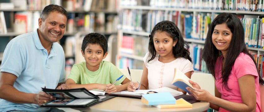 smiling family in the library