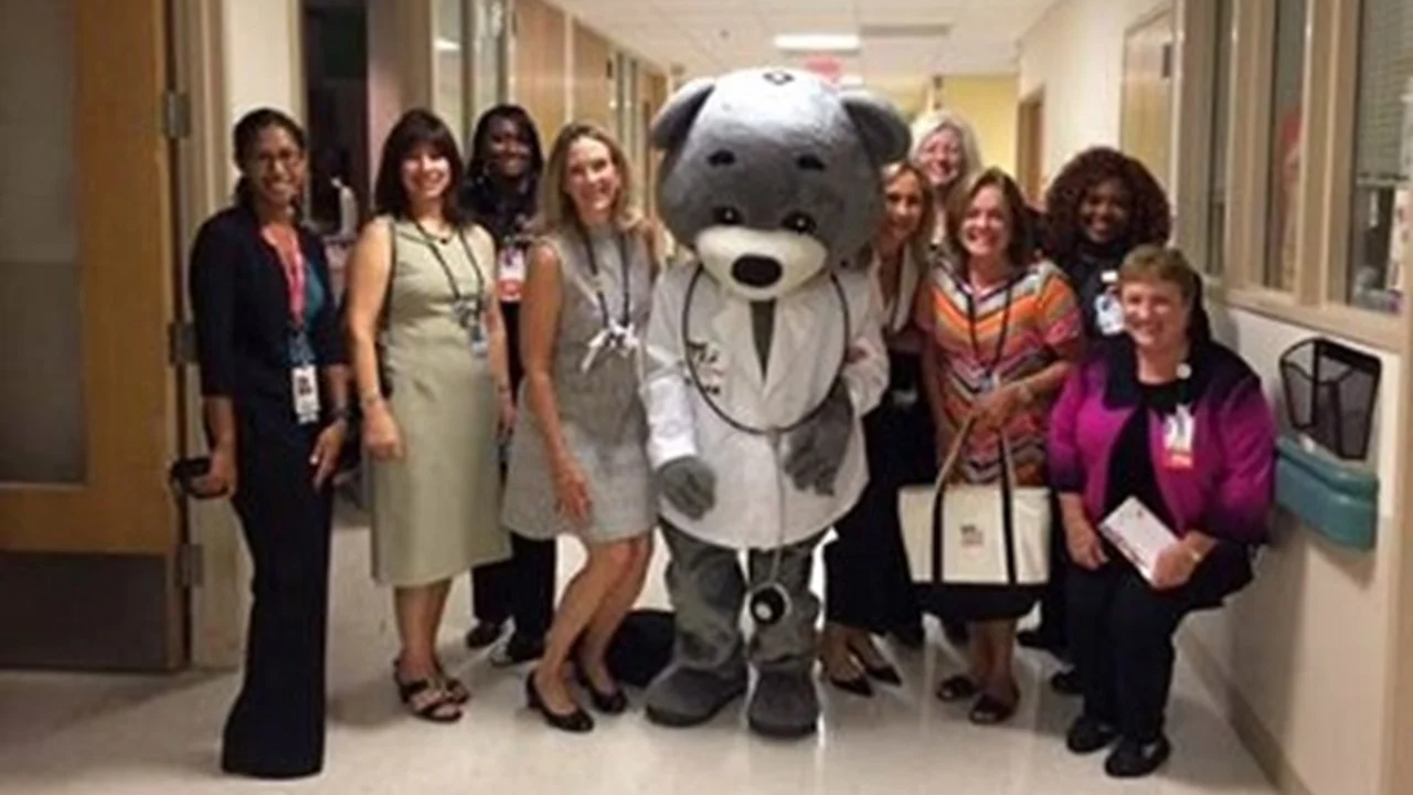 Dr. Bear and providers standing for a group photo in the hospital hallway